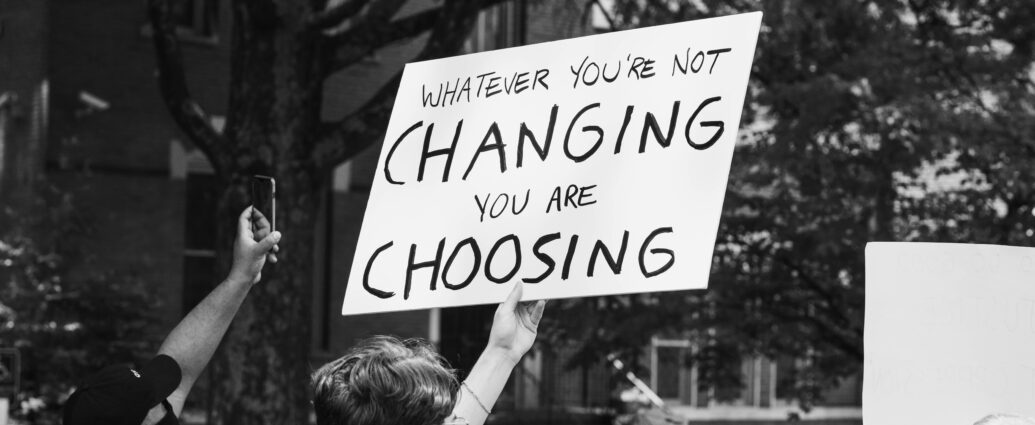 Man holding up sign at protest