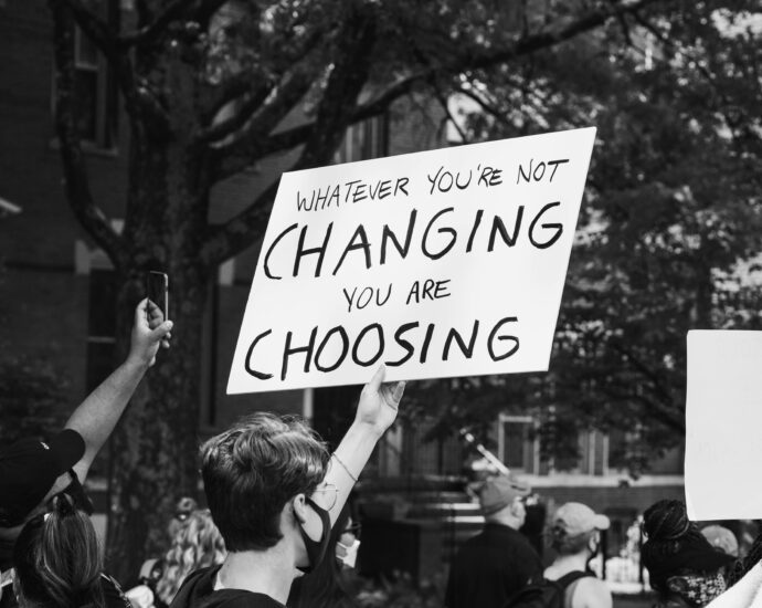 Man holding up sign at protest