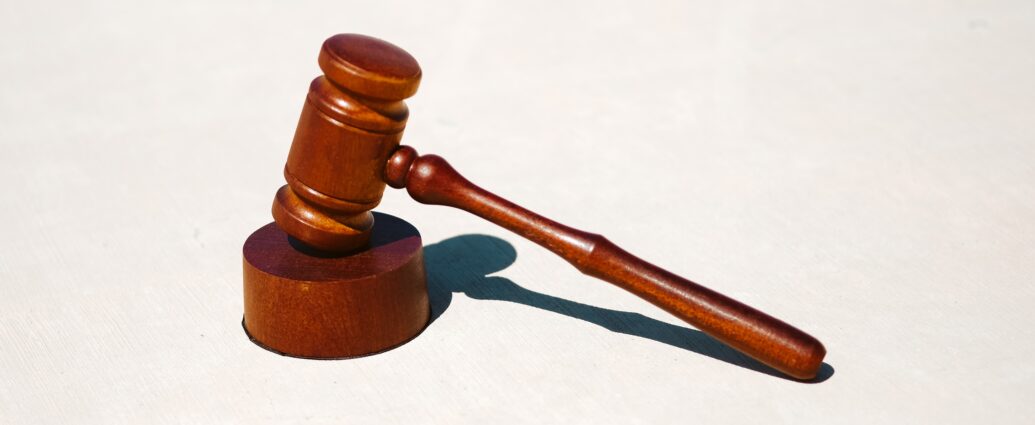 Wooden legal hammer on white surface. Stephen Bear was found guilty of multiple sexual offences in court on 3 March.