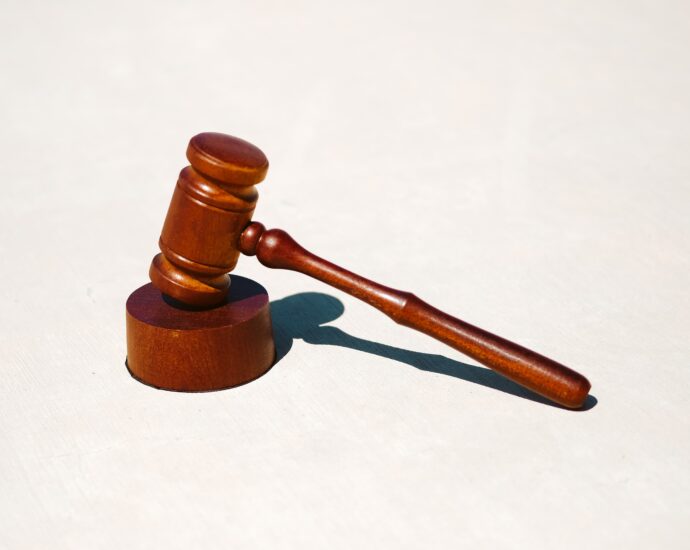 Wooden legal hammer on white surface. Stephen Bear was found guilty of multiple sexual offences in court on 3 March.