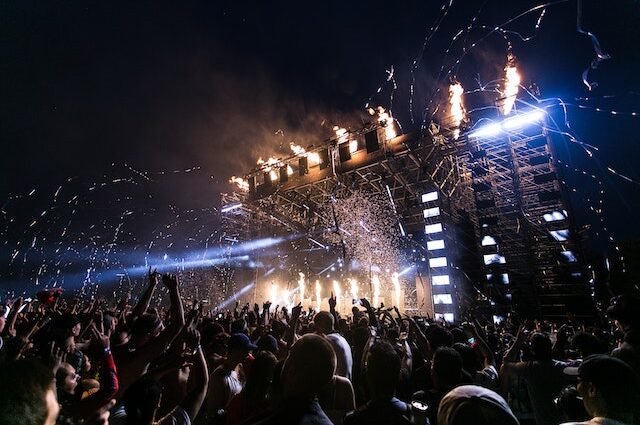 festival stage at night with fireworks