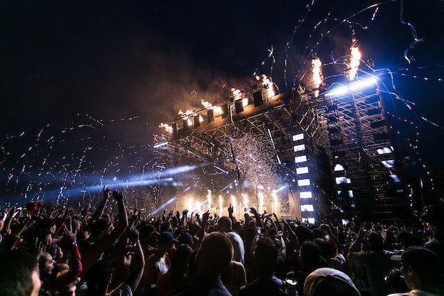 festival stage at night with fireworks