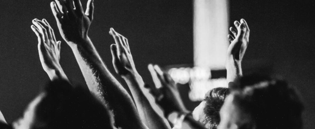 Black and White crowd cheering and clapping