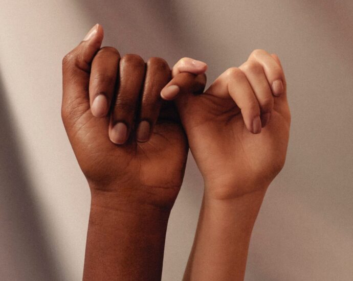 friends holing each other's pinky fingers