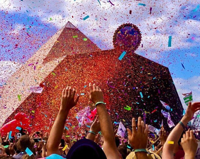 Confetti and crowds in front of Glastonbury's Pyramid Stage - the setting of this year's showdown between Rina Sawayama and Matty Healy