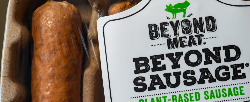 Image shows a packet of 'beyond meat' sausages: a meat industry sausage alternative.