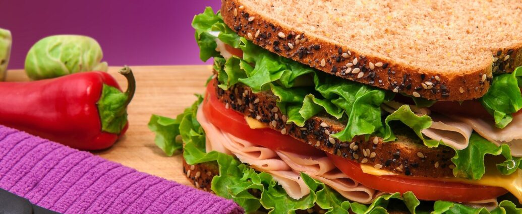 Image shows a sandwich on a table.