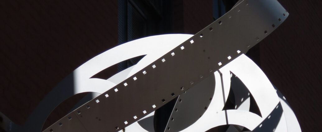 A black and white image of a film reel