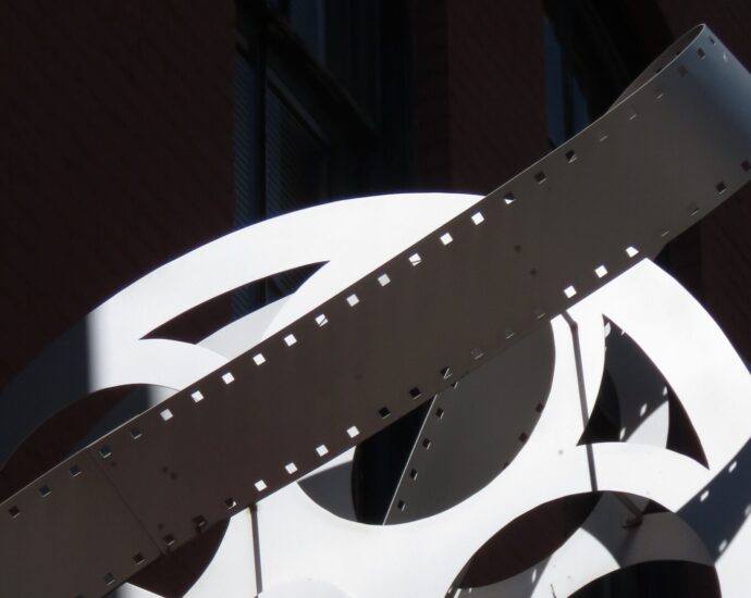 A black and white image of a film reel