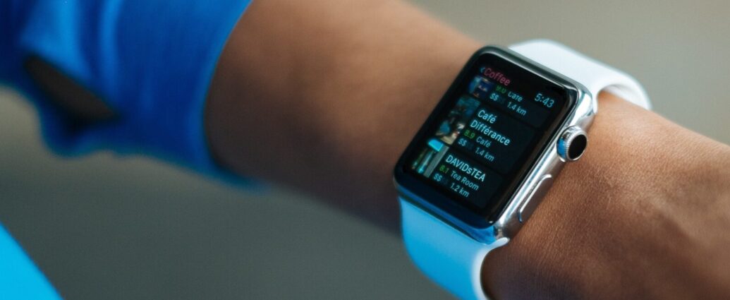 Image shows an outstretched arm sporting an Apple Watch, a device that is commonly used to track 10,000 steps