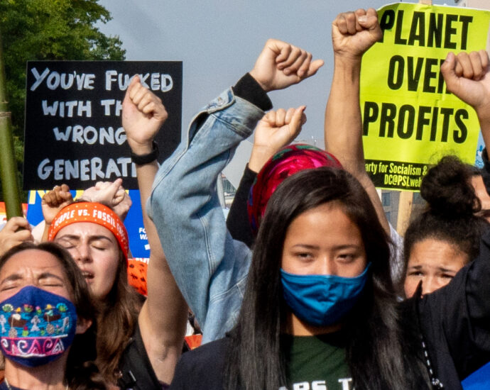Image of climate protesters on Pennsylvania Avenue. People vs. Fossil Fuels, 10/15/21