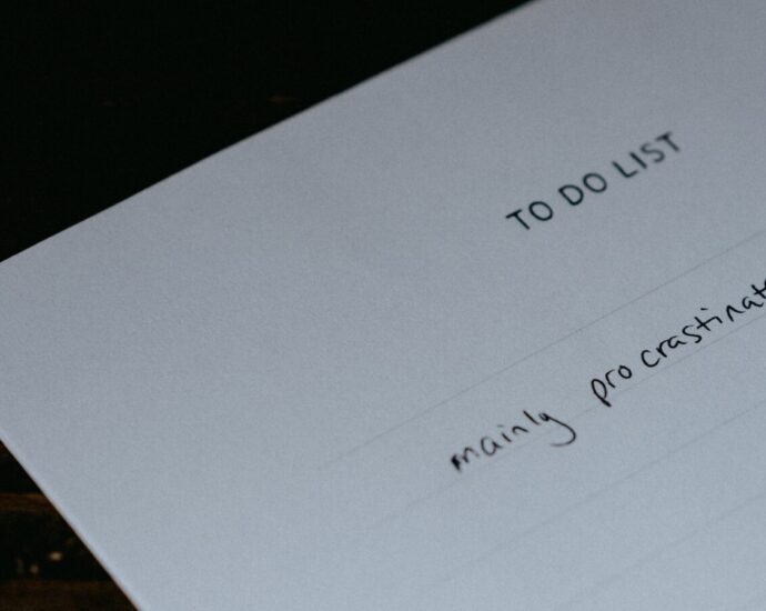 Image shows a piece of paper with a to-do list that says 'mainly procrastinate' [procrastination]