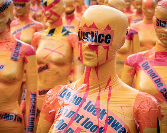 Image shows mannequins covered with slogans against sexual violence [perfect victim myth]