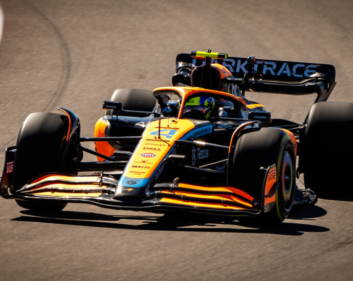 Image shows a Formula 1 car n race track.