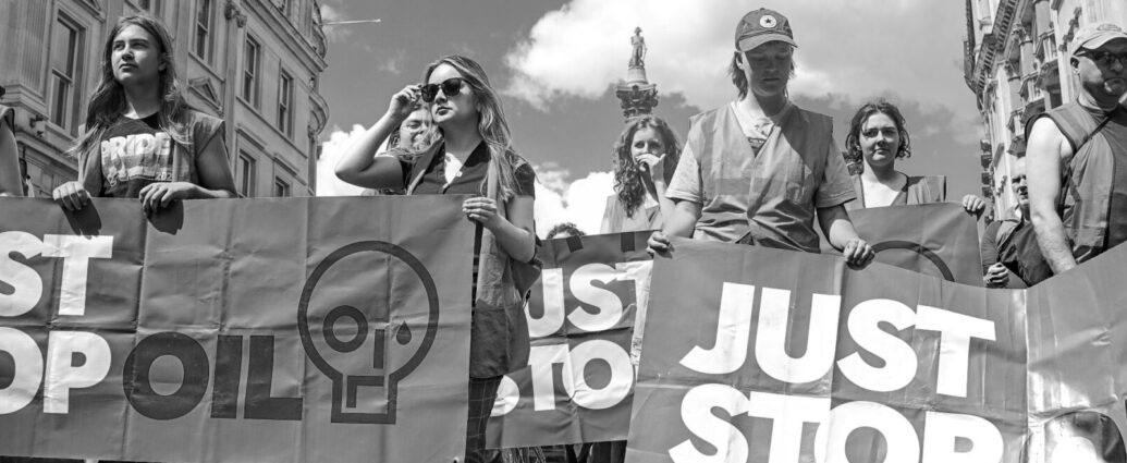 Black and white image of Just Stop Oil protestors.