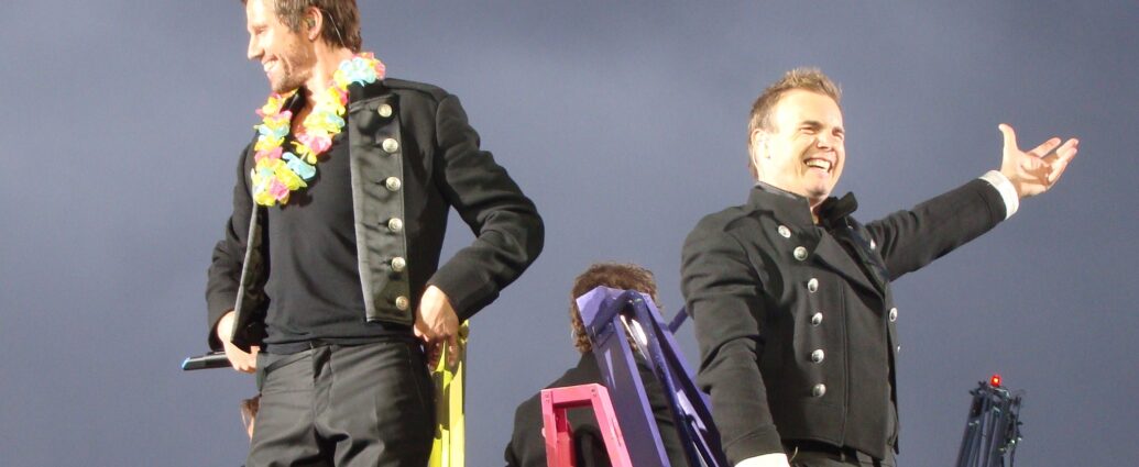 Howard Donald and Gary Barlow of Take That performing live on stage (2009).