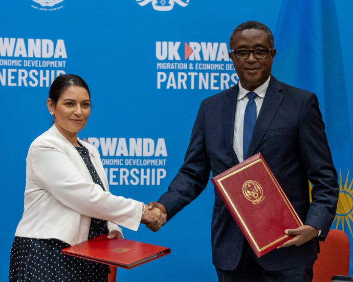 Ex-Home Secretary Priti Patel and Minister Biruta sign the migration and economic development partnership between the UK and Rwanda.