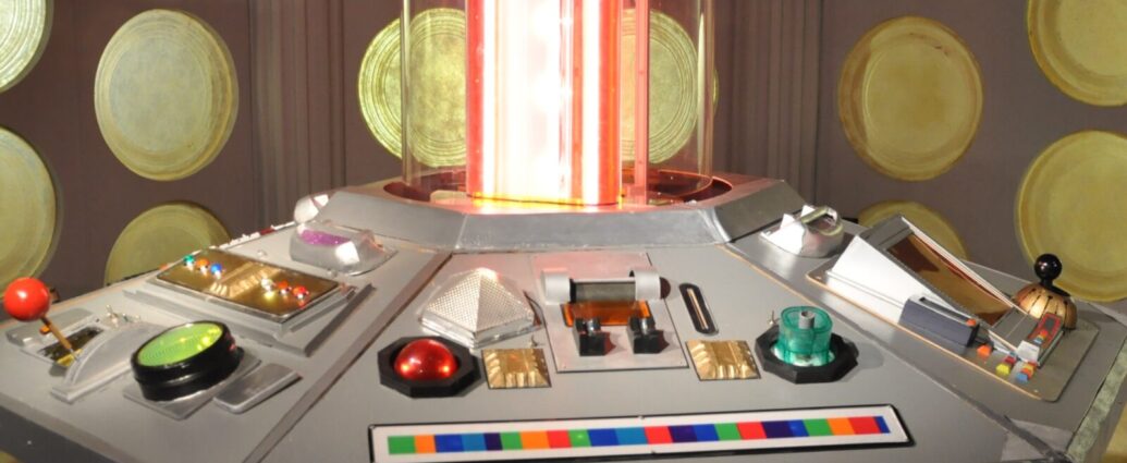 The futuristic control room of the TARDIS with lots of buttons and flashing lights.