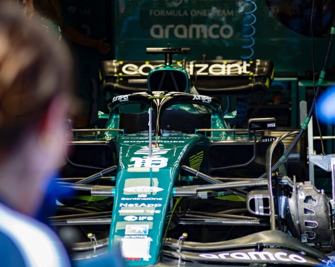 green and black Formula 1 car. Formula 1's sustainability strategy.