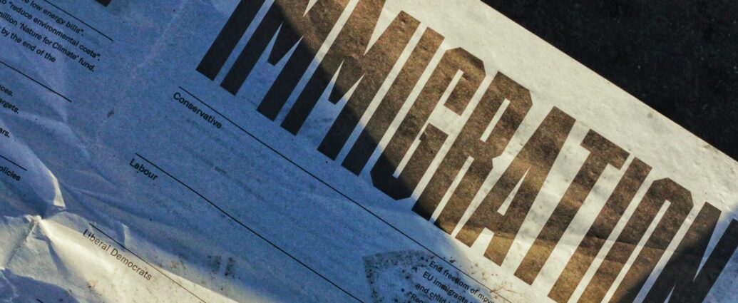 Newspaper with headline 'IMMIGRATION', portraying asylum seekers rhetoric.