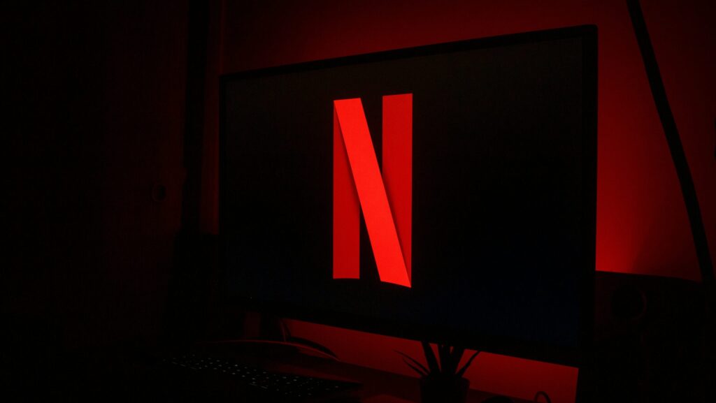 Black tv screen with red Netflix logo. Netflix's One Day