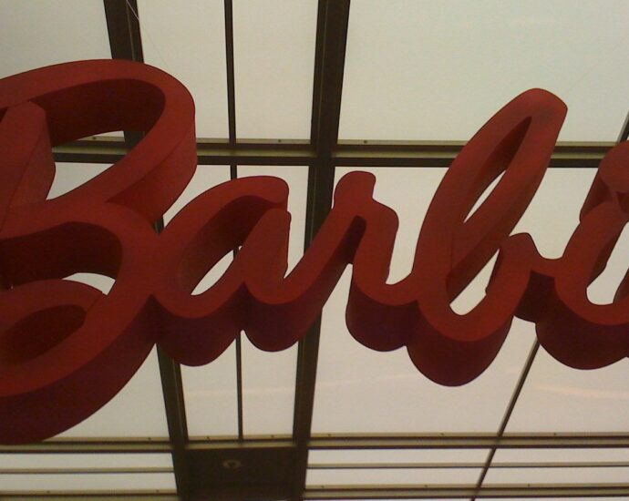 pink barbie logo against low light