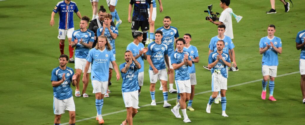 Manchester City walk the pitch at Tokyo National Stadium in 2023.