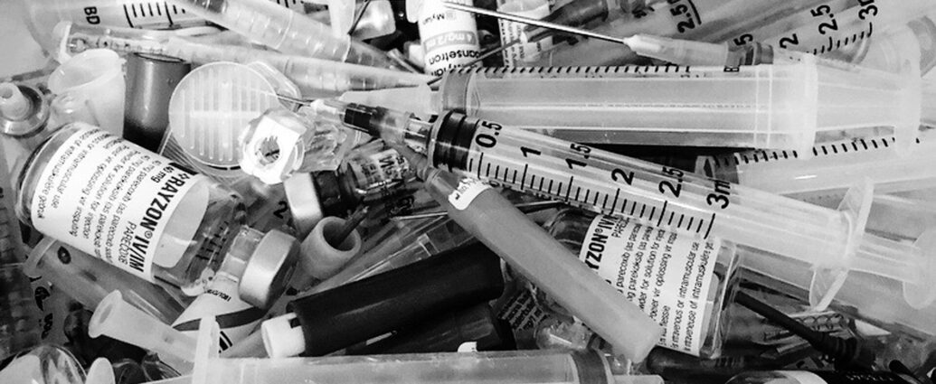 mixture of clear glass and white syringes