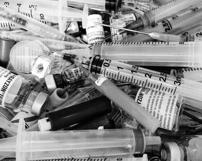 mixture of clear glass and white syringes