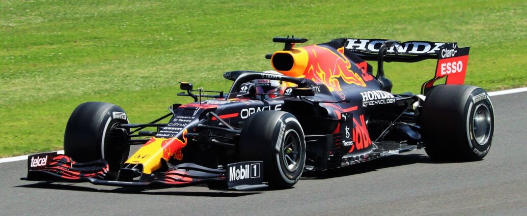 black, red and yellow formula one car on the Bahrain Grand Prix 2024 track