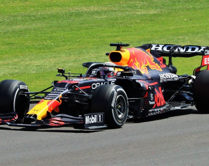 black, red and yellow formula one car on the Bahrain Grand Prix 2024 track