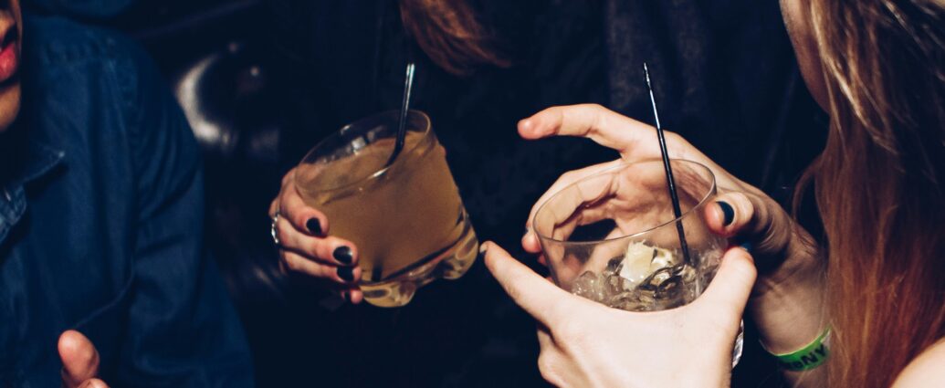 Two women holding drinks