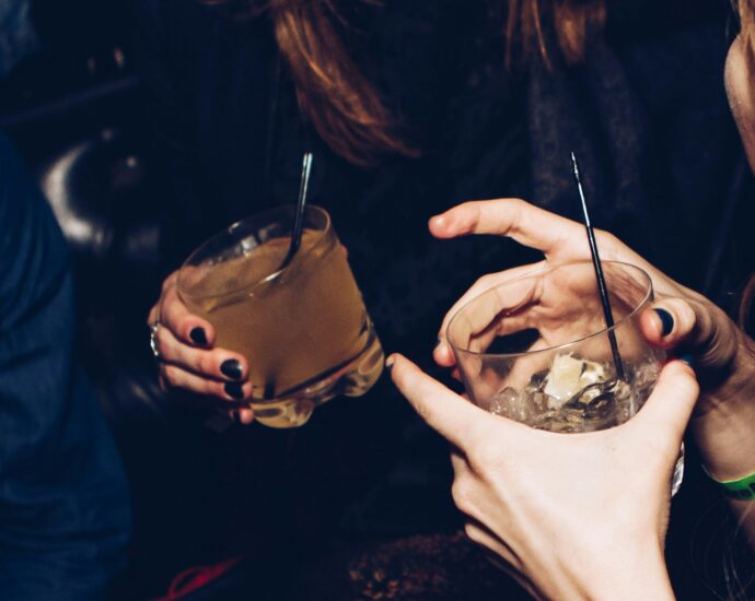 Two women holding drinks