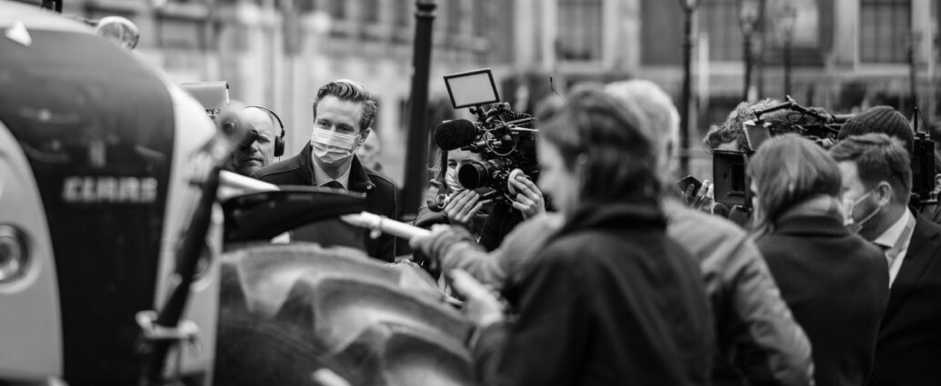 A group of journalists conducting interviews.