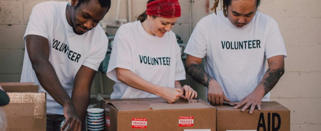 Image shows a group of people volunteering