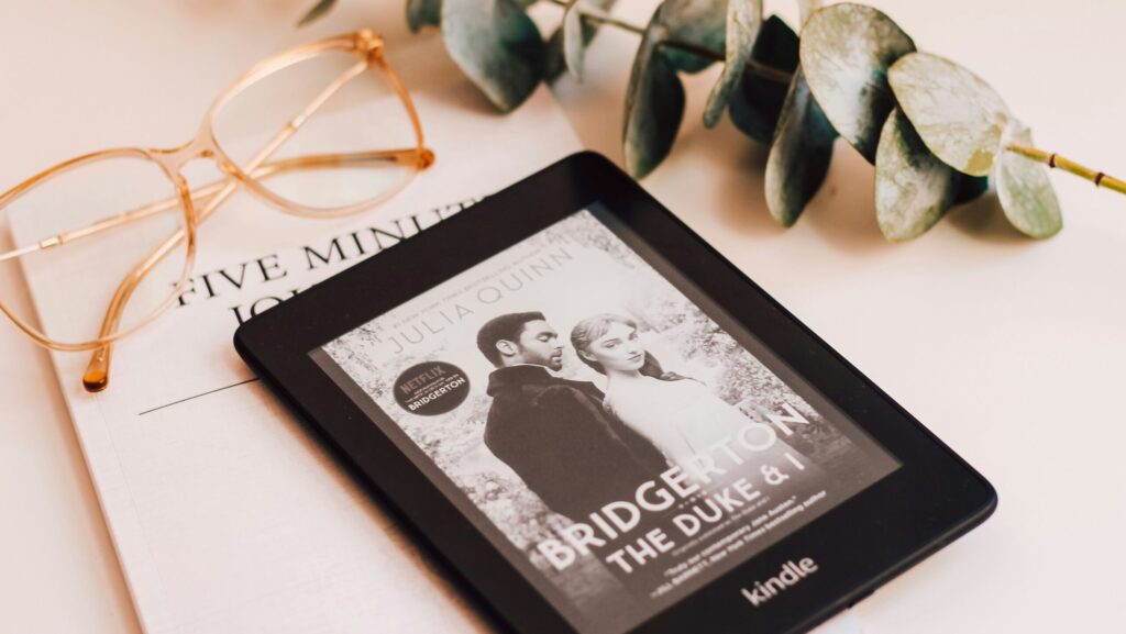 a kindle showing Bridgerton poster