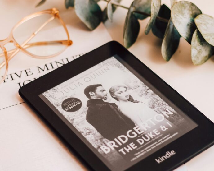 a kindle showing Bridgerton poster