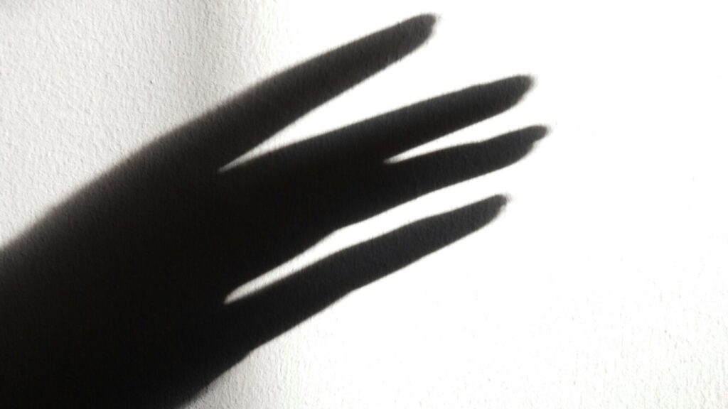 A silhouette of a hand