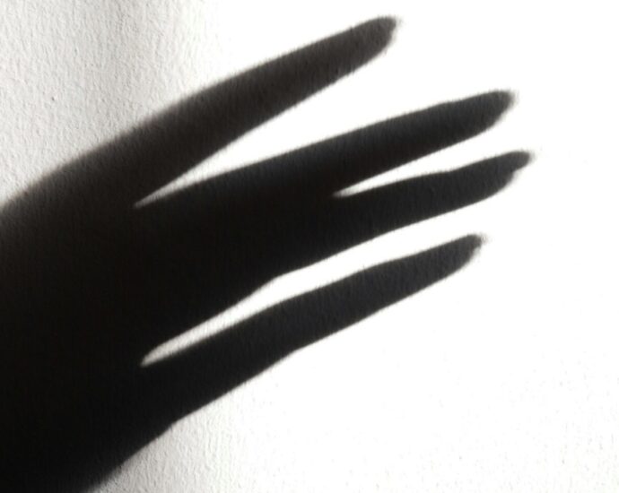 A silhouette of a hand