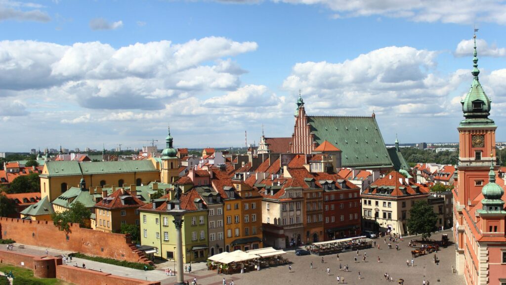 An image of Warsaw, where A Real Pain takes place, showing bright buildings and blue skies