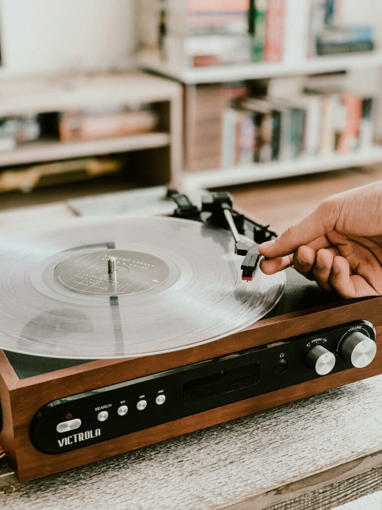 Vinyl record playing on record player in a house.