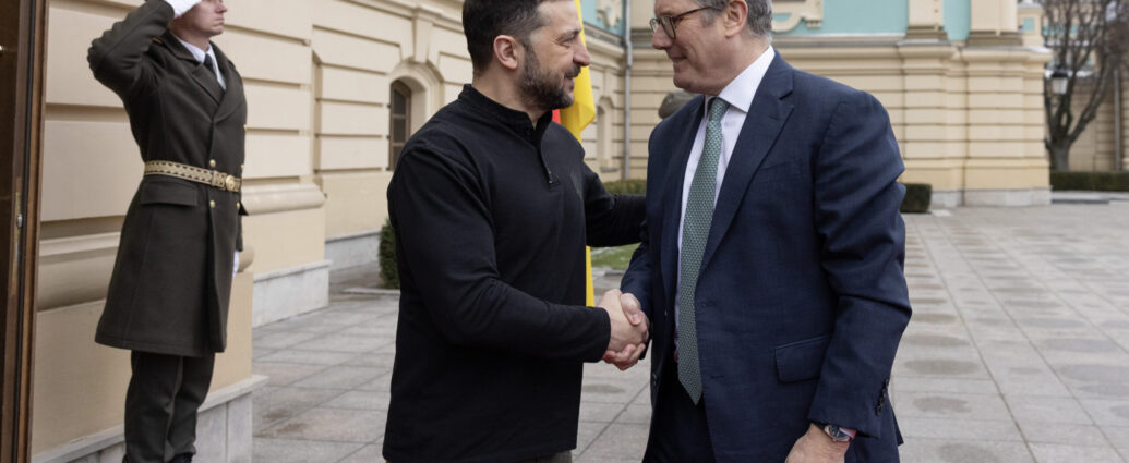 UK Prime Minister Keir Starmer shakes hands with President of Ukraine Volodymyr Zelenskyy