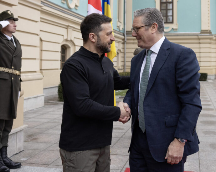 UK Prime Minister Keir Starmer shakes hands with President of Ukraine Volodymyr Zelenskyy