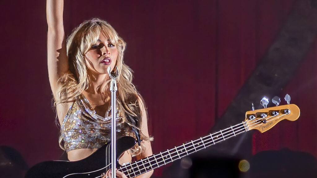 Sabrina Carpenter with guitar performing at the Wiltern