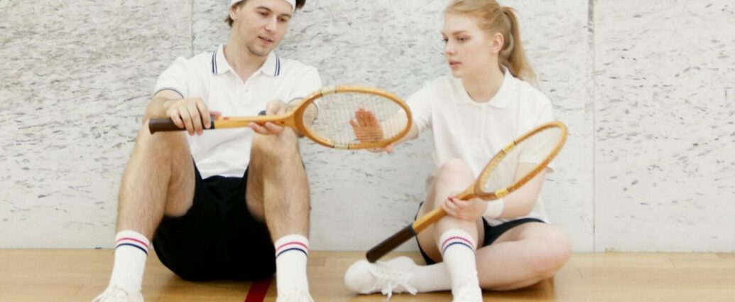 A couple exercising and playing tennis together