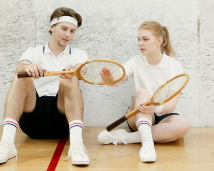 A couple exercising and playing tennis together