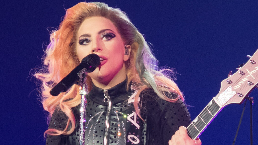 Lady Gaga singing with guitar