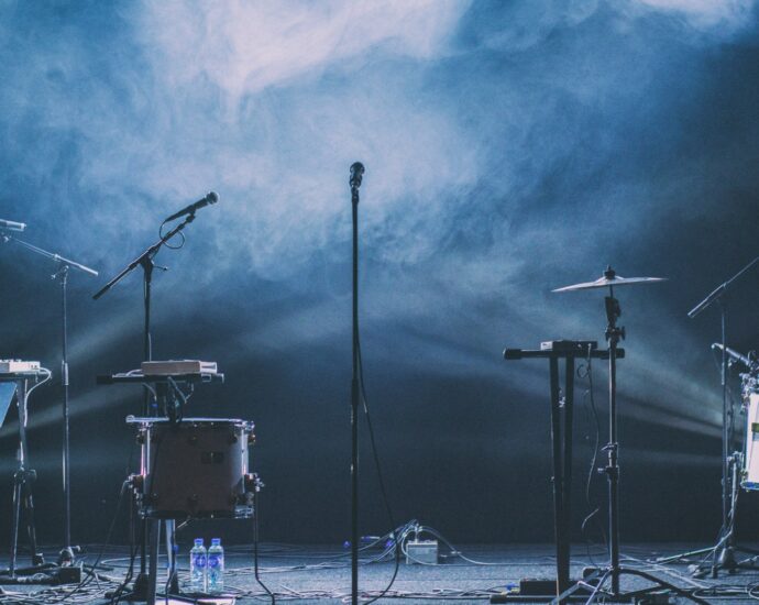 Microphones and musical instruments on stage for a music review