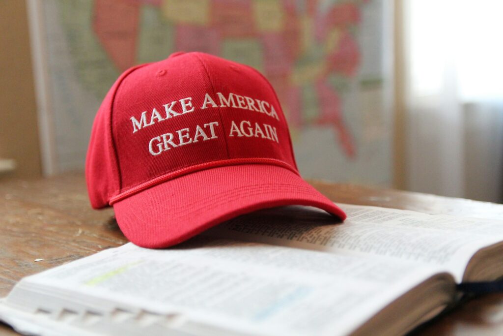MAGA hat sitting on top of a bible.